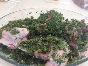 Raw chicken pieces coated in herb paste